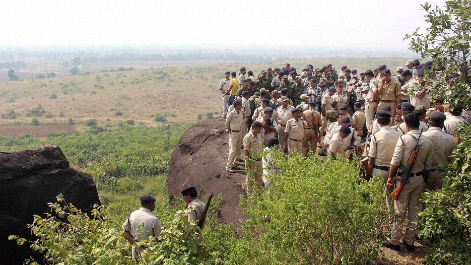 Police at the encounter site at the hillocks near MP’s Manikhedi Patthar village after the STF killed 8 suspected SIMI members. (Photo: PTI)