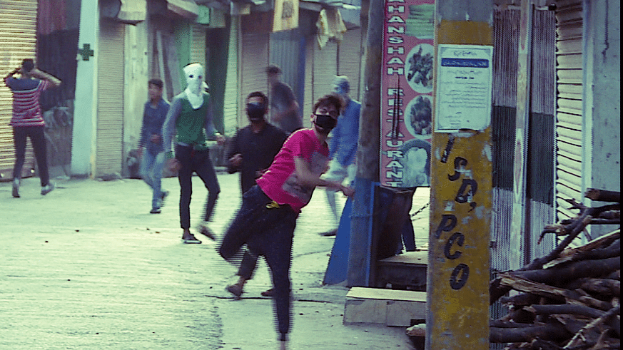 File photo of a stone-pelter at Nowhata Chowk in Srinagar.
