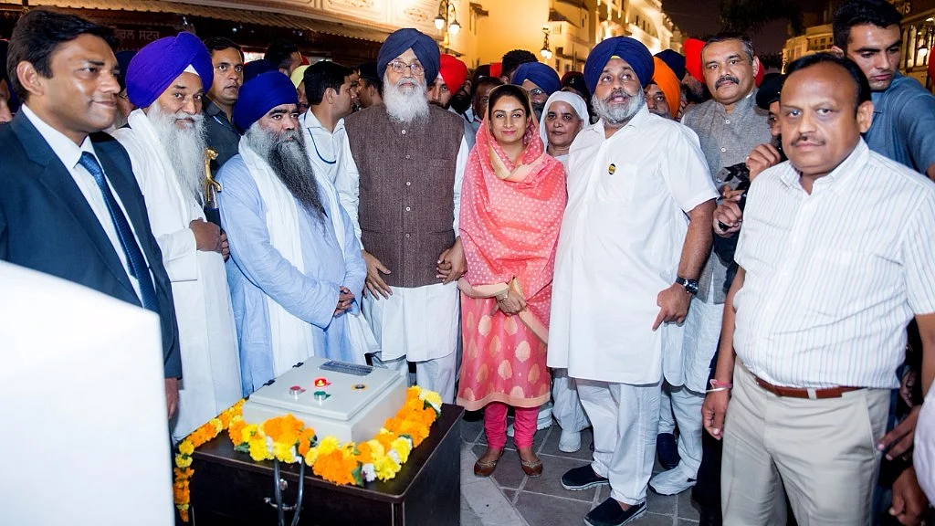 Punjab Chief Minister Parkash Singh Badal and Deputy Chief Minister Sukhbir Singh Badal during the inauguration of the Amritsar Beautification Project on 25 October 2016. (Photo: IANS)