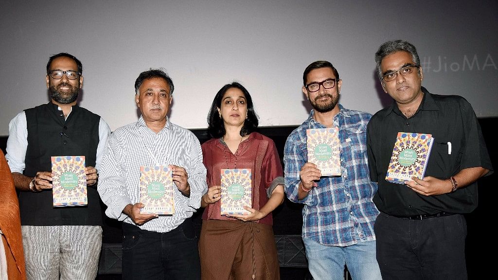 Mansoor Khan (second from left) and Aamir Khan (fourth from left) launch the book. (Photo: Yogen Shah)