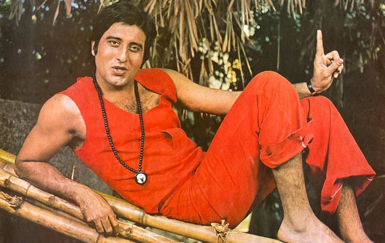 Vinod Khanna in orange and and the beaded necklace.