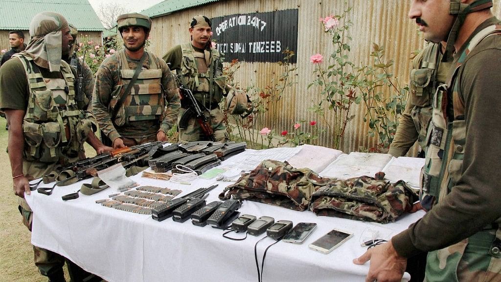 Photo for Representational Purposes. Army personnel display a huge cache of arms, ammunition and other items seized from the three militants who were killed after they attacked an Army camp in Handwara district of north Kashmir on Thursday.