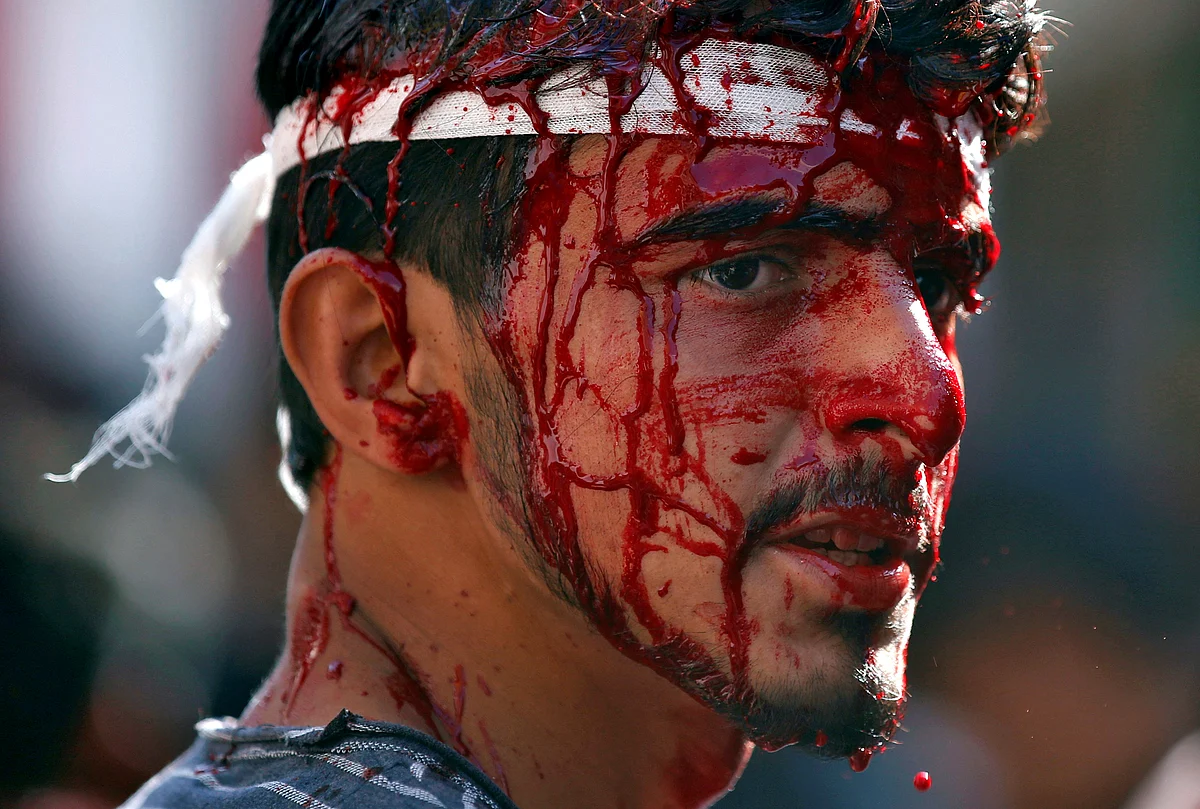 A Kashmiri Shia Muslim bleeds after he flagellated himself during a Muharram procession in Srinagar. (Photo: Reuters/Danish Ismail)