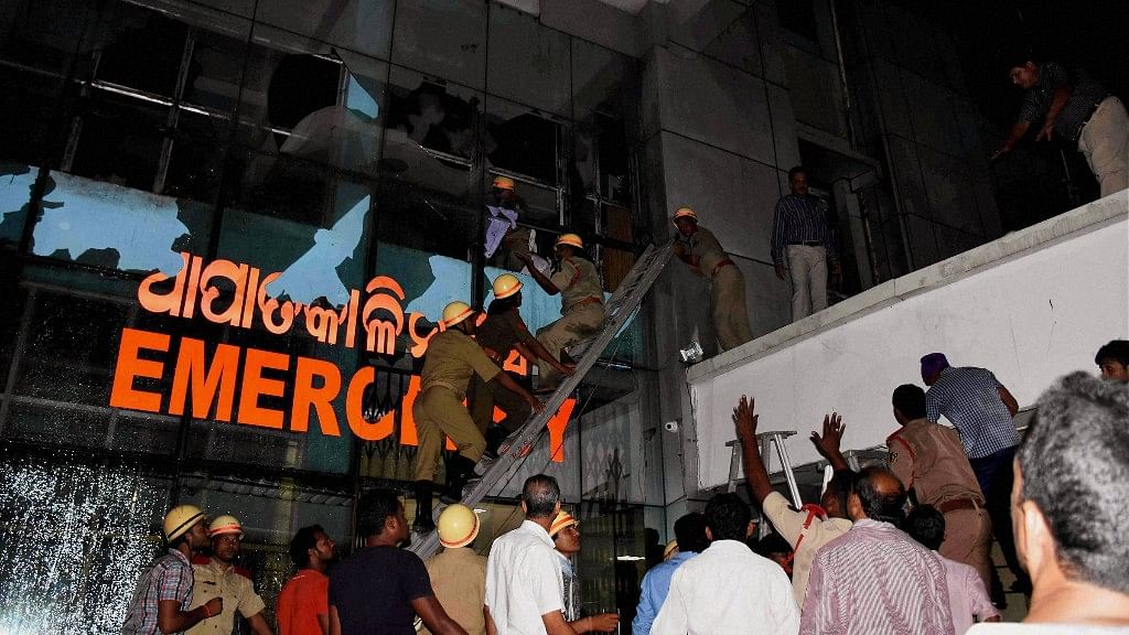  Rescue team in action at SUM Hospital where a fire broke out on Monday night. (Photo: PTI)