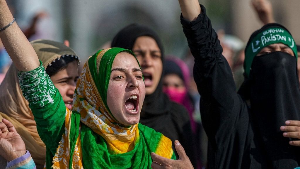 Kashmiri Muslim women shout anti-government slogans during the funeral procession of Junaid Ahmed, a 12-year-old boy, in Srinagar on  October 8 2016. (Photo: AP Photo/Dar Yasin)