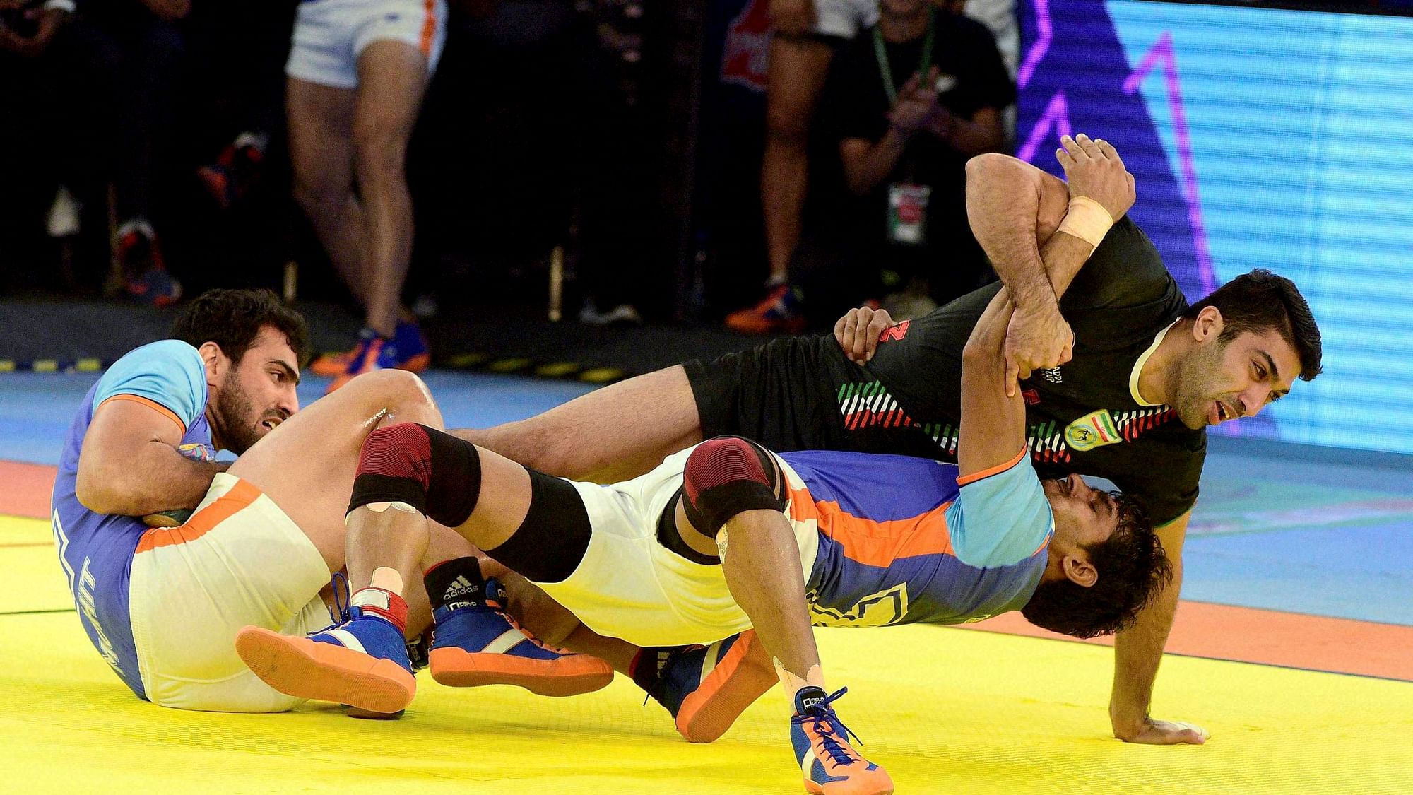 Indian players successfully got 2 points for a “Super Tackle against Iran during the final match of Kabaddi World Cup 2016 in Ahmedabad on Saturday. (Photo: PTI)