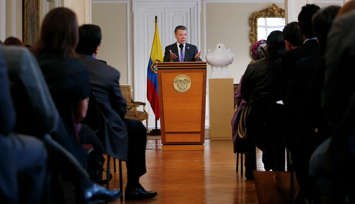 Juan Manuel Santos speaks to supporters of the peace deal he signed with rebels of FARC. (Photo: AP)