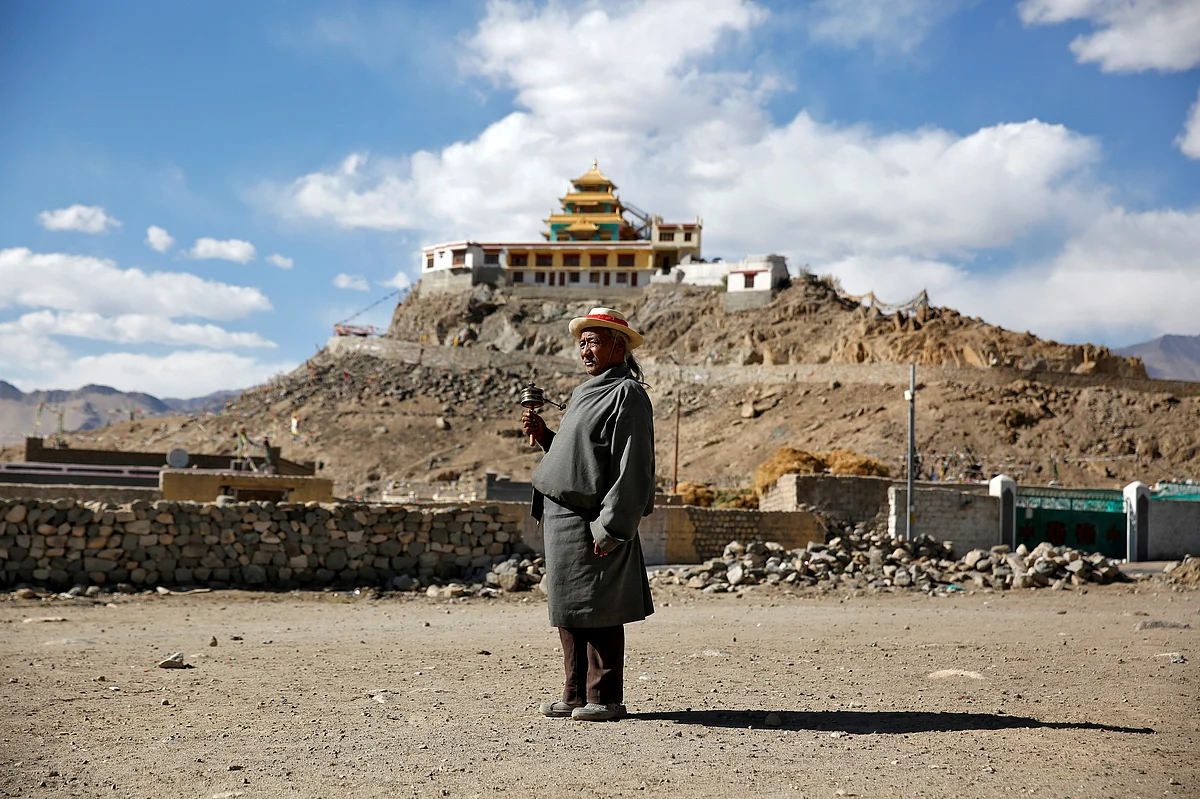 Dorsey Takapa, 65, a former goat herder, poses for a photograph in Choklamsar village. When asked how living in the world’s fastest growing major economy had affected life, Takapa replied: “Traditional values are being lost as we focus on money.” (Photo: Reuters/Cathal McNaughton)