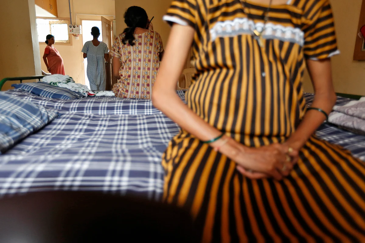 Surrogate mothers rest inside a temporary home for surrogates provided by Akanksha IVF centre in Anand town. (Photo: Reuters)
