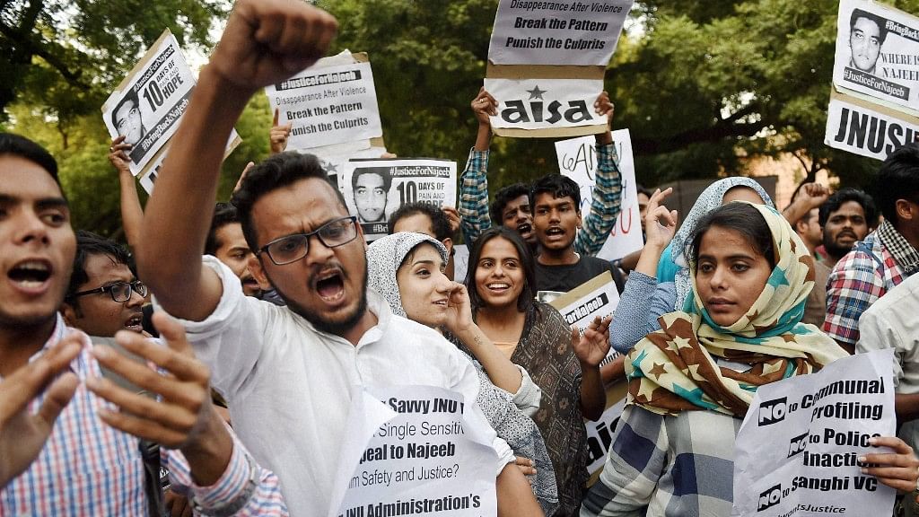 Members of JNUSU and other students organisations shout slogans during a protest march over missing of JNU student Najeeb, in New Delhi on Monday. (Photo: PTI)