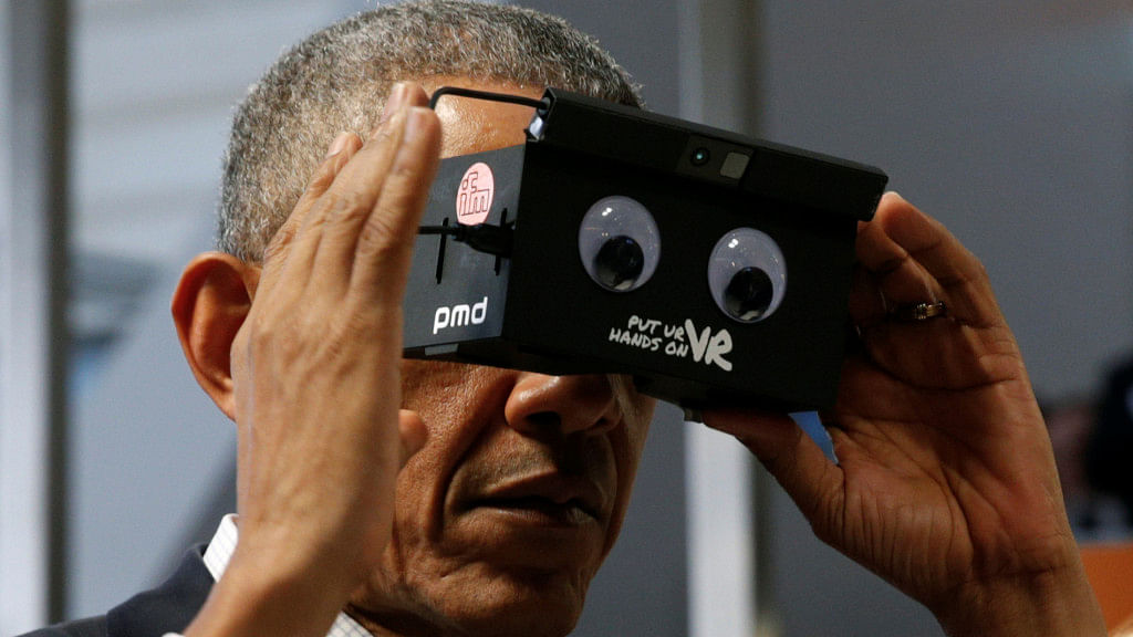 US President Barack Obama tries virtual reality glasses. (Photo: Reuters)