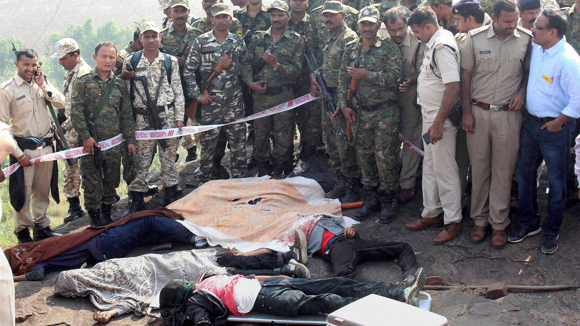 File photo of police at the encounter site at the hillocks of Acharpura village after the STF killed 8 Students of Islamic Movement of India (SIMI) activists who escaped Central Jail killing a security guard in Bhopal on Monday.&nbsp;