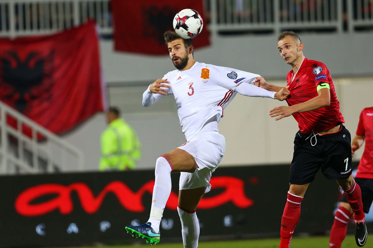 

Pique cut off the sleeves from his shirt which bore Spain’s colours of yellow and red in Spain’s Sunday qualifier.