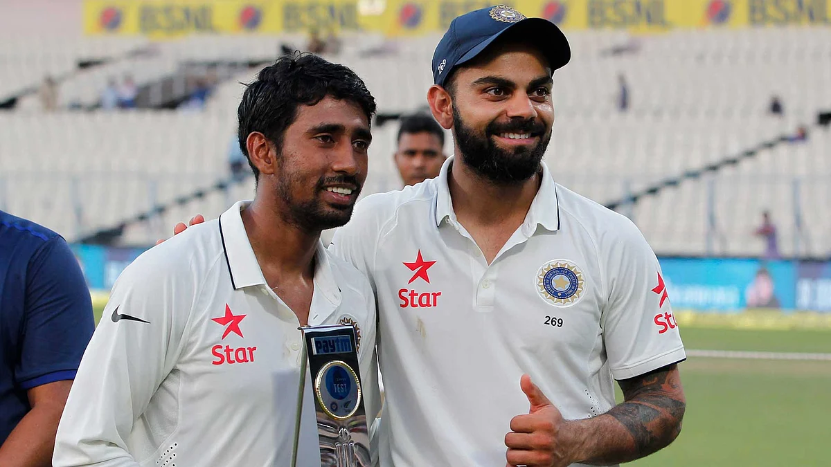 File picture of Wriddhiman Saha with skipper Virat Kohli.
