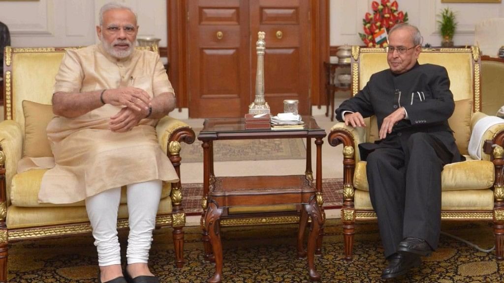 Prime Minister Narendra Modi met President Pranab Mukherjee to brief him about the security situation. (Photo: ANI)