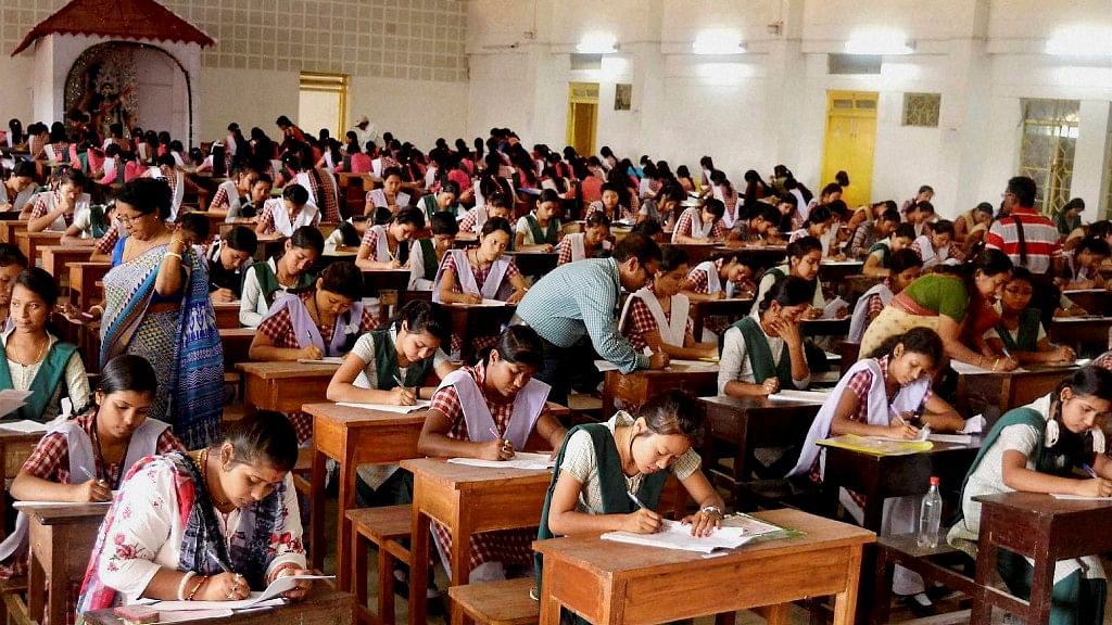 

 Students appear for class 12th Board exams in a school at Agartala. (Photo: PTI)