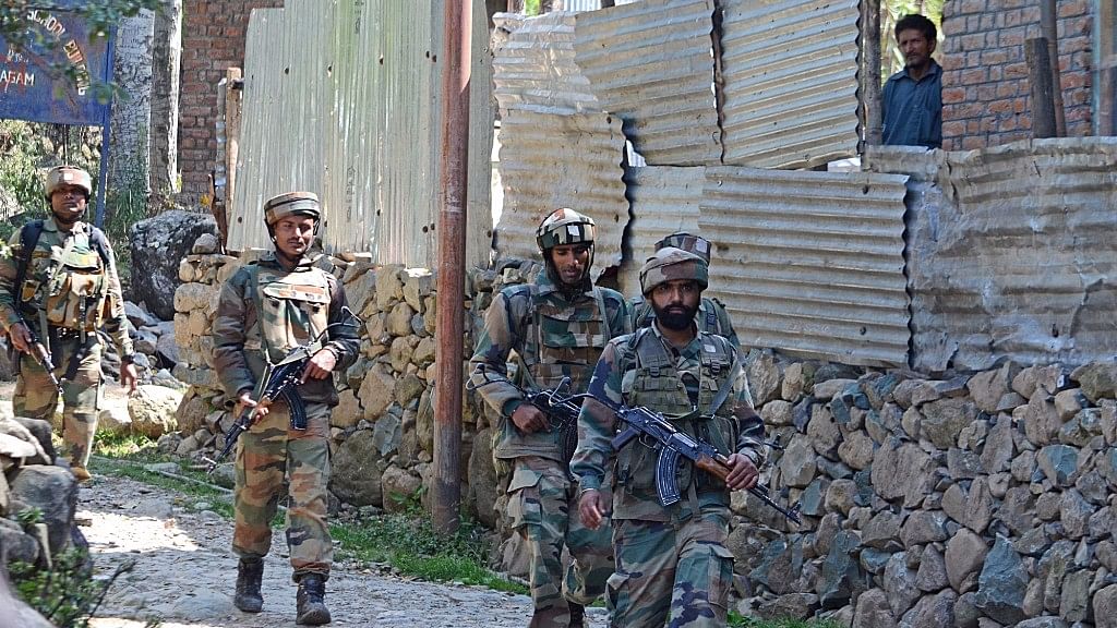 

Soldiers in action during an encounter with militants in Aragam Chitti Bandi village of Jammu and Kashmir’s Bandipora district on 22 September, 2016. (Photo: IANS)