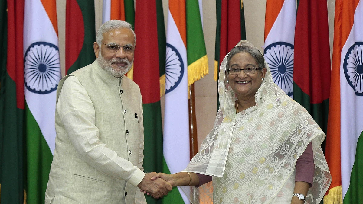 Prime Minister Narendra Modi shakes hands with Prime Minister Sheikh Hasina during his visit to Bangladesh. (Photo: AP)
