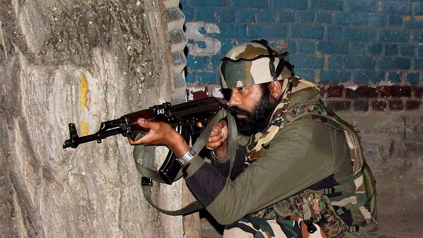 A soldier takes position during an encounter with the militants who attacked an army base camp in Baramulla district of north Kashmir, 3 October 2016.&nbsp;
