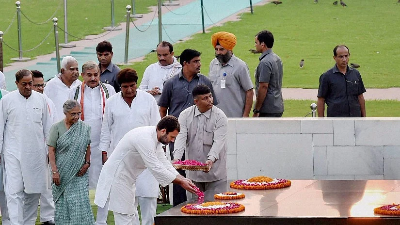Congress Vice-President Rahul Gandhi pays homage at Rajghat in New Delhi on Thursday (Photo: PTI)