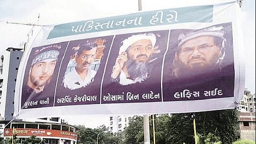 Posters have been seen in Gujarat placing Kejriwal alongside Osama bin Laden, Hafiz Saeed and Burhan Wani. (Photo Courtesy: Twitter/<a href="https://twitter.com/kcsnegi">@kcsnegi</a>)