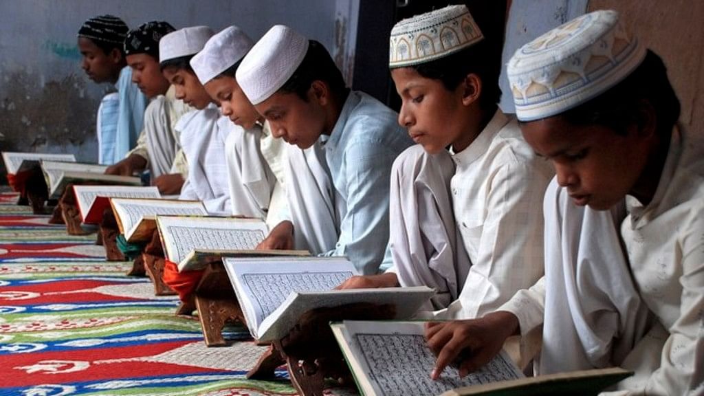 File photo of children reading the Koran at a madarsa on the first day of the holy month of Ramadan. (Photo: Reuters)