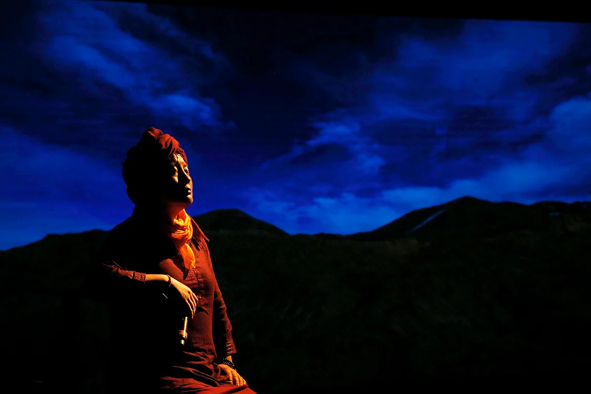 Buddhist nun and musician Ani Choying Drolma performs during a concert in Mumbai. With more than 12 albums of melodious Nepali tunes and Tibetan hymns that highlight the themes of peace and harmony, the songstress in saffron robes has won hearts across the Himalayan nation and abroad. (Photo: AP Photo/Rajanish Kakade)