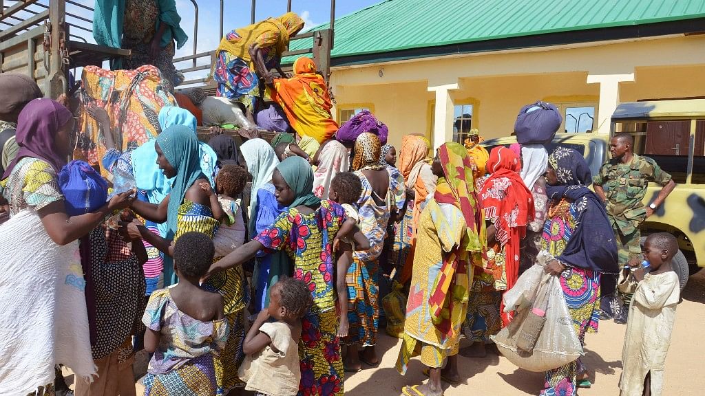 In this 2015 file photo,
women and children rescued by Nigerian soldiers from Boko Haram extremists in
the northeast of Nigeria arrive at the military office in Maiduguri. Photo used for representational purpose. (Photo: AP)