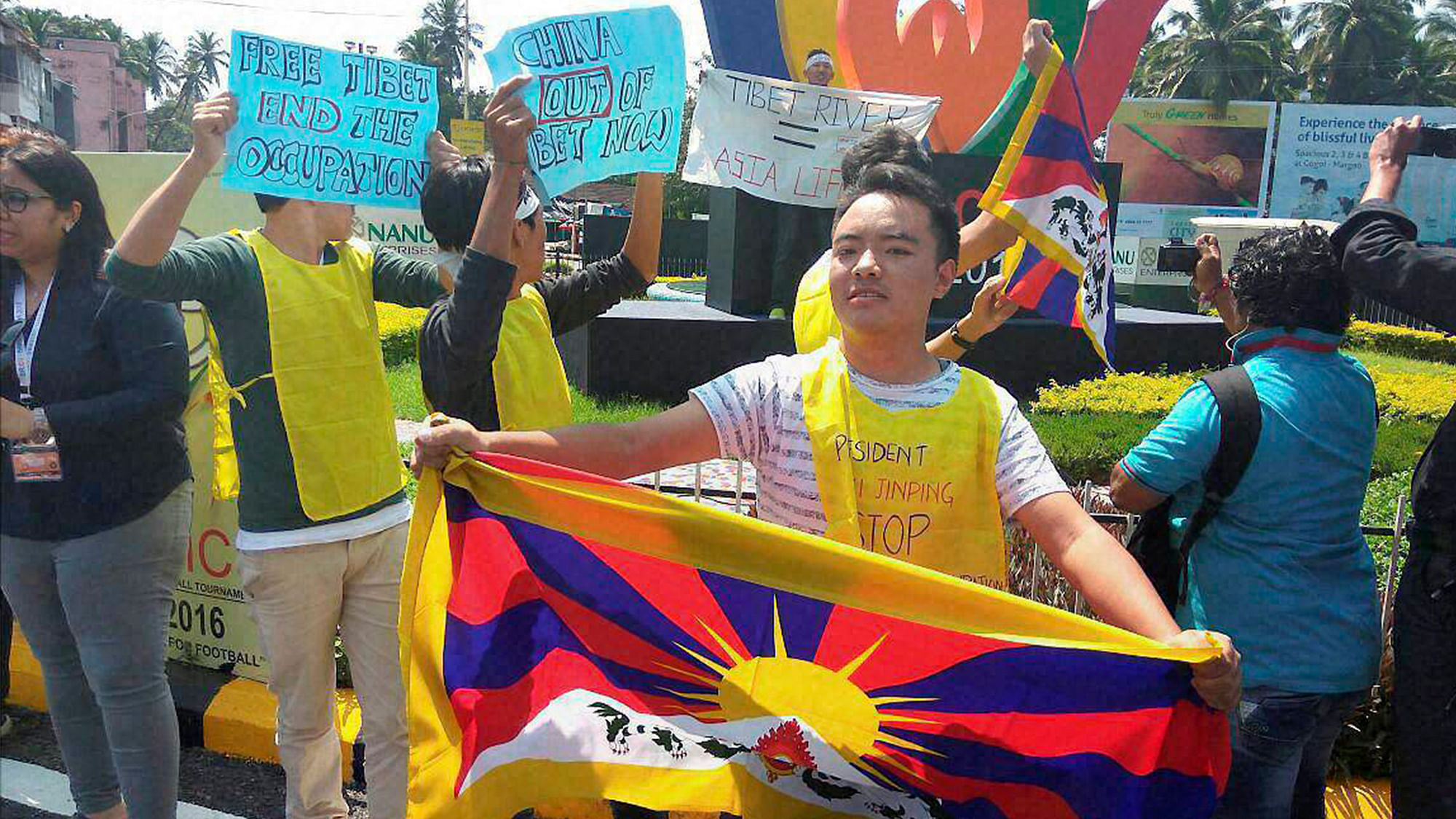 Tibetans display placards during protest against China demanding Tibet be freed, at Margao, Goa on Saturday. 