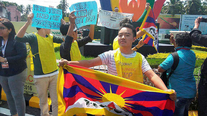Tibetans display placards during protest against China demanding Tibet be freed, at Margao, Goa on Saturday. Photo/Nawang Phuntsog/ The Quint
