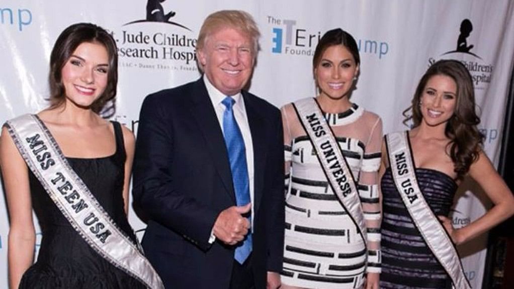 Trump with the winners of the beauty pageants he owned, in 2014. (Photo Courtesy: Facebook/<a href="https://www.facebook.com/MissUSA/photos/a.10152467535802968.1073741885.273963707967/10152467536472968/?type=3&amp;theater">@MissUSA</a>)