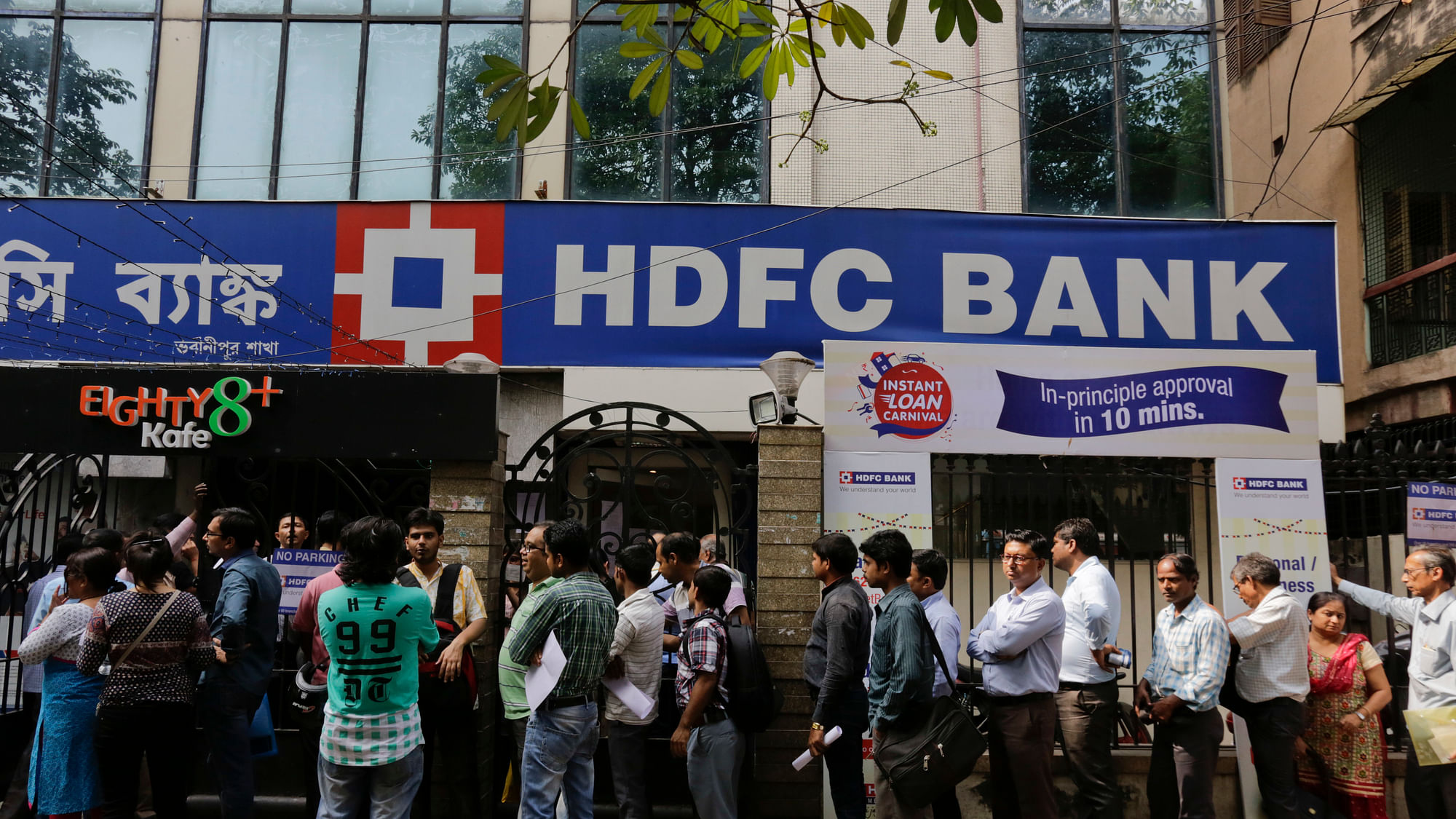 People queue up outside a branch of HDFC bank.&nbsp;