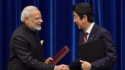 India’s Prime Minister Narendra Modi, left, and Japan’s Prime Minister Shinzo Abe shake hands after signing a joint statement at Abe’s official residence in Tokyo, Japan, Friday, 11 November 2016. (Photo: AP)