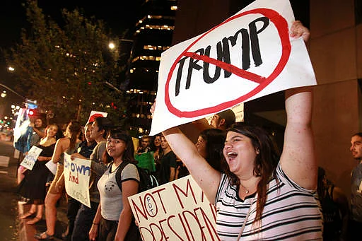 People on Broadway on 9 November 2016, in downtown San Diego, during a protest in opposition of Donald Trump’s presidential election victory. (Photo: AP)
