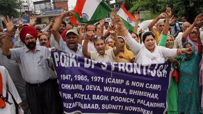 Pakistan occupied Kashmir refugees shout slogans during a protest for their various demands in Jammu. (Photo: PTI)