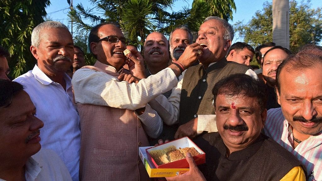 MP Chief Minister Shivraj Singh Chouhan  celebrates the party’s victory in the Shahdol Loksabha and Nepa Nagar Assembly by-elections, in Bhopal on Tuesday. (Photo: PTI)