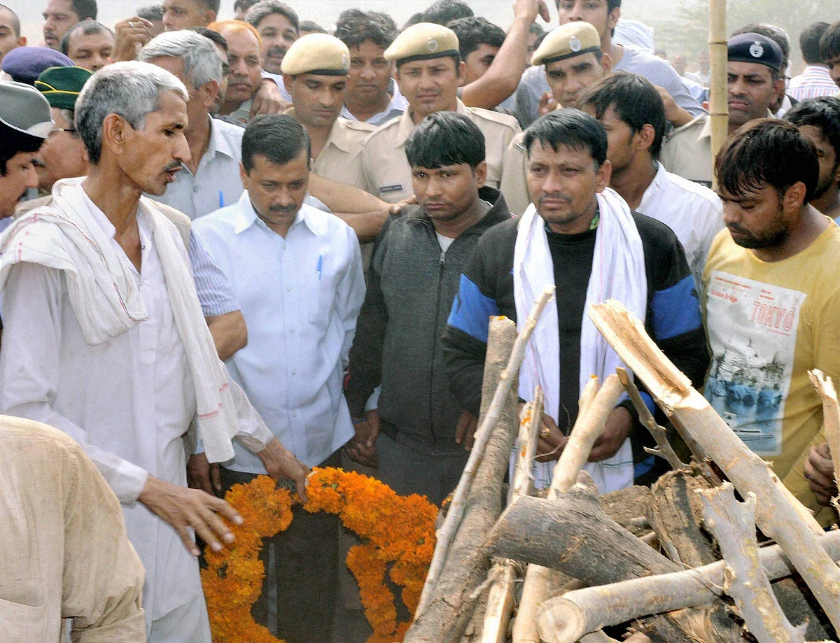 Delhi CM Kejriwal attending the funeral of Ram Kishan Grewal on Thursday. (Photo: PTI)