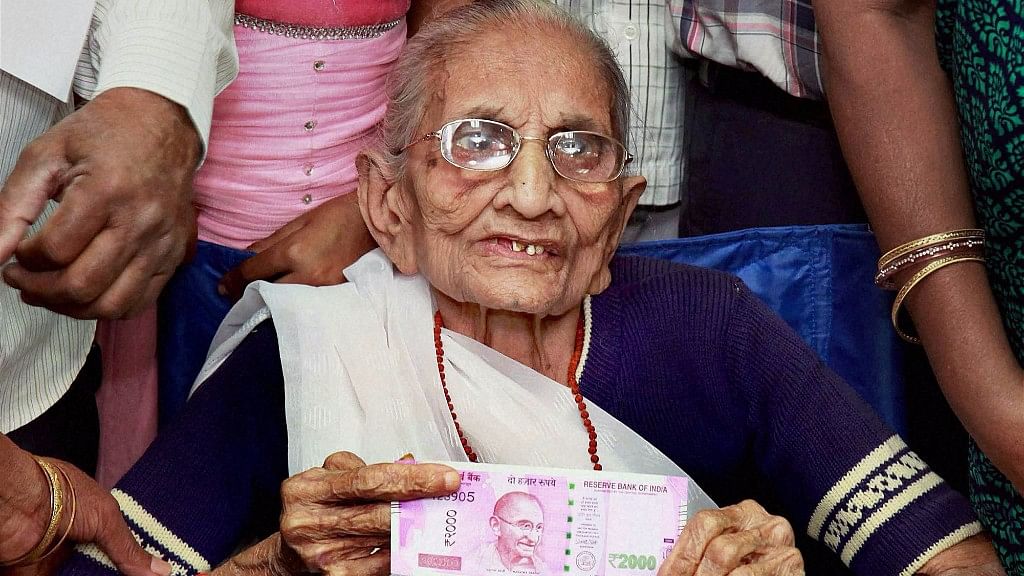 Prime Minister Modi’s mother Heeraben at a bank on Tuesday. (Photo: PTI)