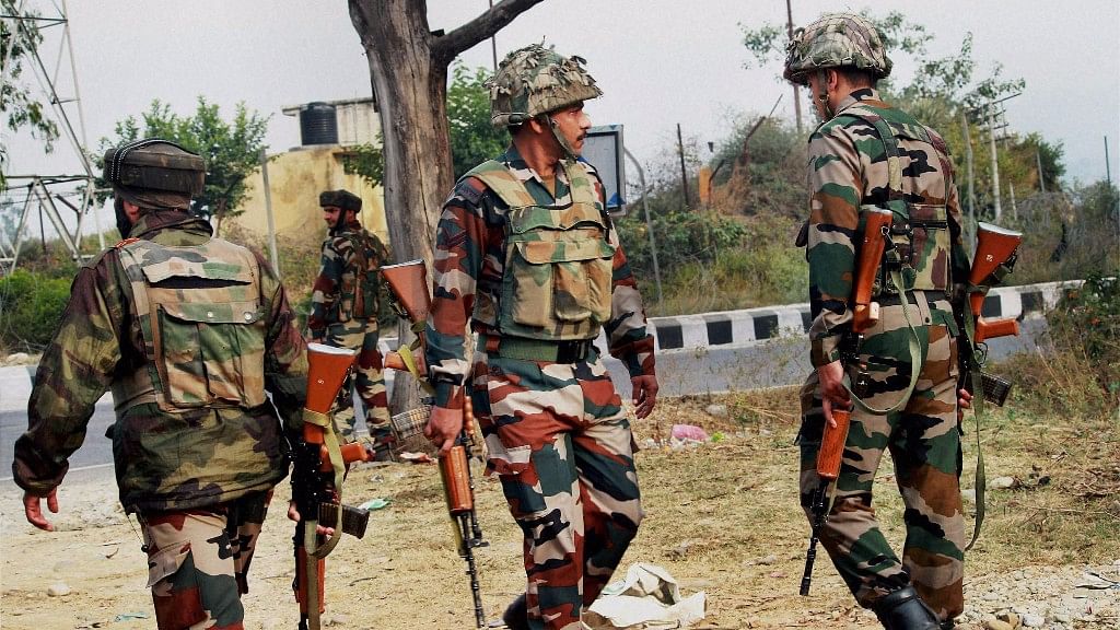 

Army personnel take position during an encounter after militants attacked an Army camp in Nagrota. (Photo: PTI)