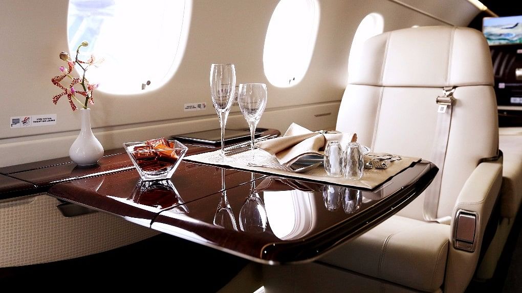 A table is set for dining aboard an Embraer SA Legacy 500 jet (Photographer: SeongJoon Cho/Bloomberg)&nbsp;