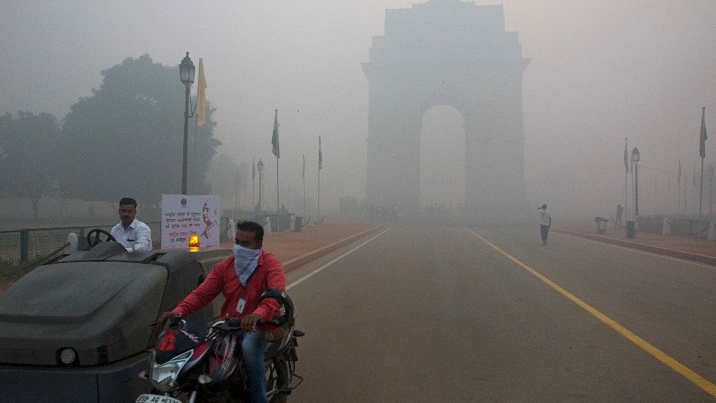 Delhi’s India Gate enveloped by smog on the morning after Diwali. (Photo: AP)