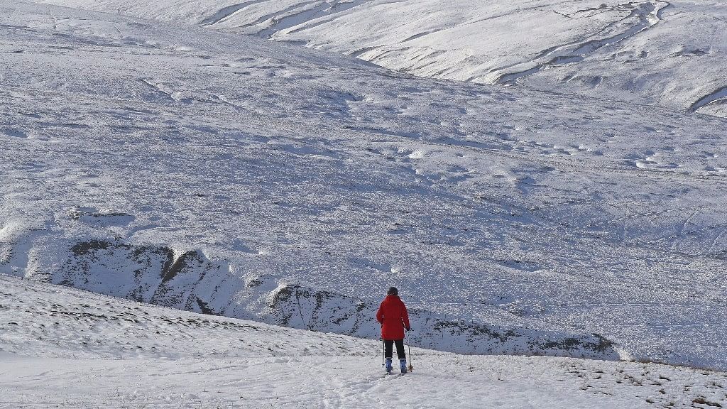  A skier takes to the slopes at the Yad Moss ski slope in the North Pennines, England, on the resort’s first day of the skiing season. (Photo: AP)