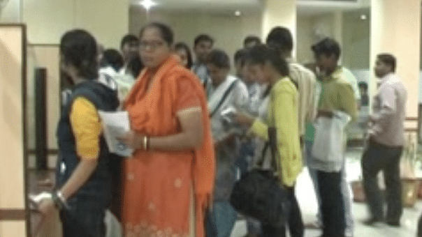 People wait in queues for hours at banks to exchange money (Photo: The Quint)