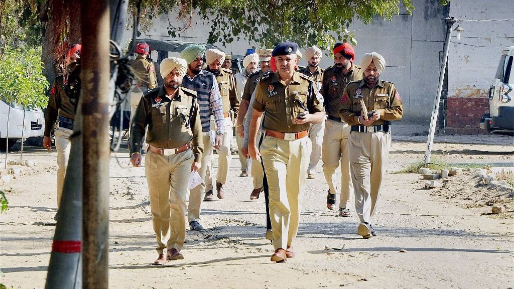 Police officials investigate after inmates  escaped from the Nabha jail on Sunday. (Photo: PTI)