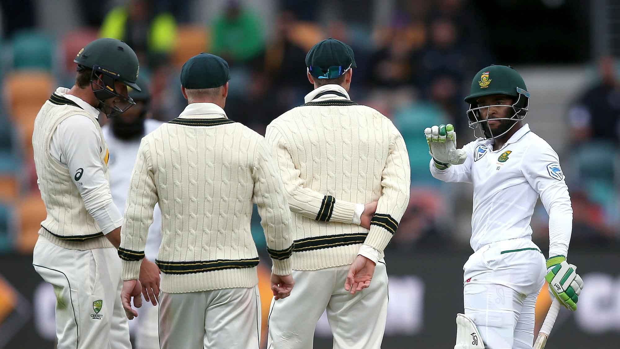 South Africa’s Temba Bavuma, right, argues with Australian players during their cricket test match in Hobart. (Photo: AP)