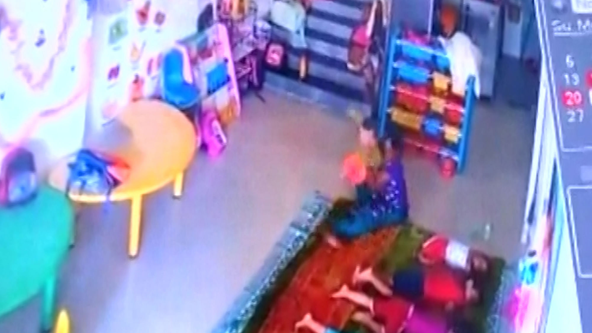 Toddler being assaulted by the caretaker at a day care centre in Mumbai. (Photo Courtesy:  ANI Screengrab) 