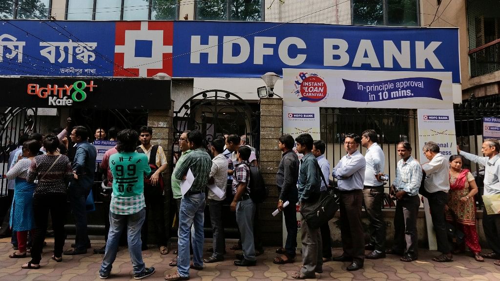 People queue outside HDFC bank.&nbsp;