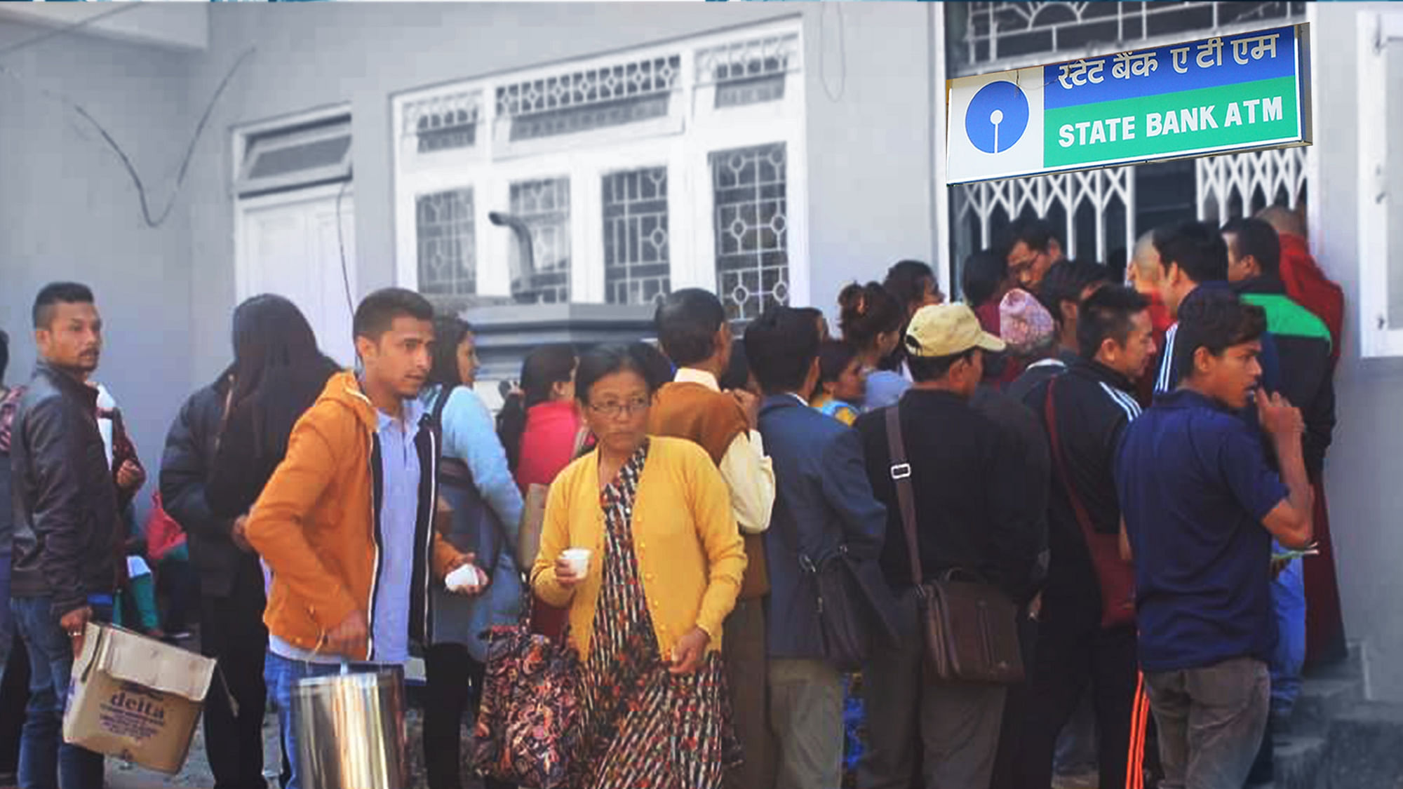 Residents of Darjeeling line up outside ATMs to withdraw money, but not without a little help from complete strangers. (Photo: Darjeeling Chronicles)