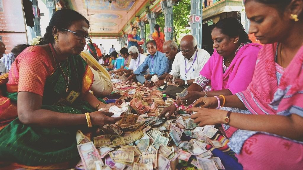 Members of Sri Kabaleeswarar Temple Trust counting the funds deposited in Hundi by devotees, following the demonetisation of Rs 500 and Rs 1,000 notes, in Chennai. (Source: PTI)