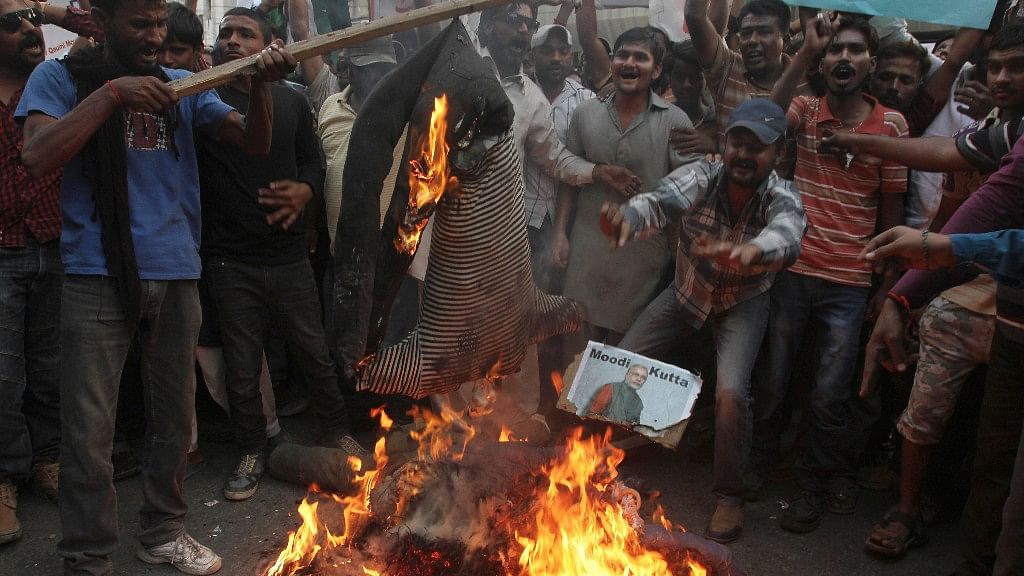 Pakistani protesters burn an effigy of Indian Prime Minister Narendra Modi during a protest in Karachi, Pakistan, Wednesday, 16 November, 2016. (Image: AP)